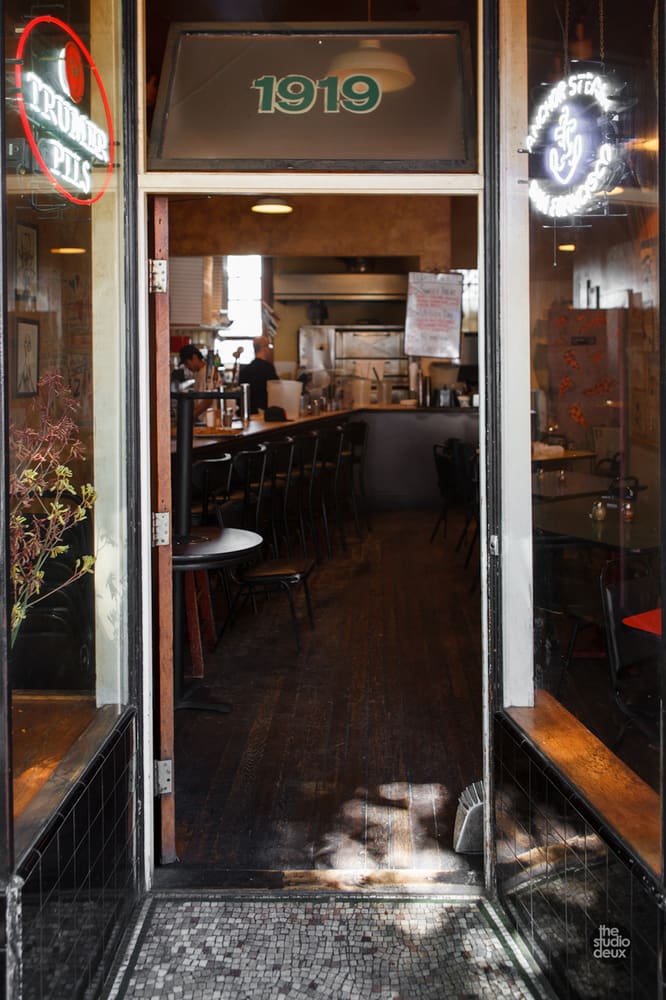 The open front door and the counter seats inside